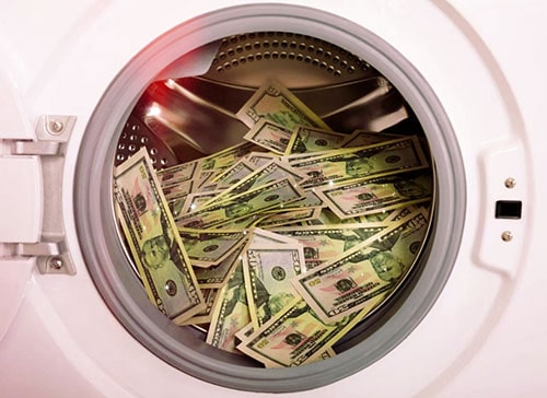 What are the three stages of money laundering and their impact on businesses